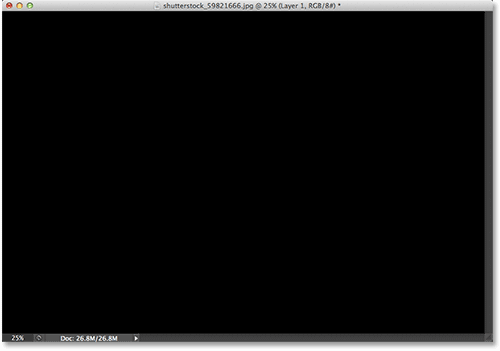 The document after filling the new layer with black. Image © 2013 Photoshop Essentials.com