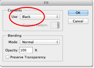 Changing the Use option to Black in the Fill dialog box. Image © 2013 Photoshop Essentials.com