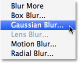 Selecting the Gaussian Blur filter from the Filter menu. Image © 2013 Photoshop Essentials.com