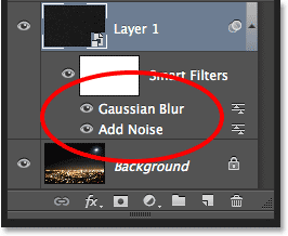 The Add Noise and Gaussian Blur Smart Filters in the Layers panel. Image © 2013 Photoshop Essentials.com
