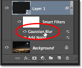 Double-clicking on the Gaussian Blur Smart Filter to re-open it. Image © 2013 Photoshop Essentials.com